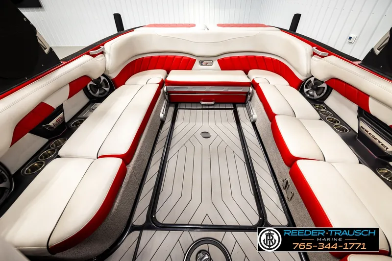 Slide: The Image of Interior of a 2017 Malibu Wakesetter 25 LSV boat with red and white seating. - 28