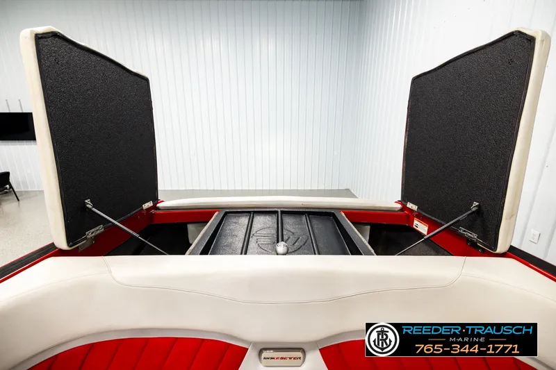 Slide: The Image of 2017 Malibu Wakesetter 25 LSV boat interior storage compartments open. - 21