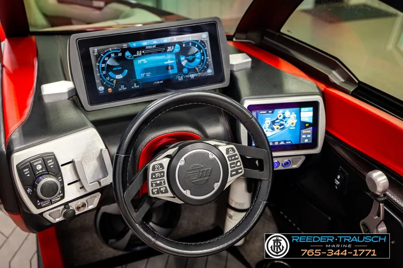 Slide: The Image of 2017 Malibu Wakesetter 25 LSV dashboard with advanced touchscreen controls and steering wheel. - 34