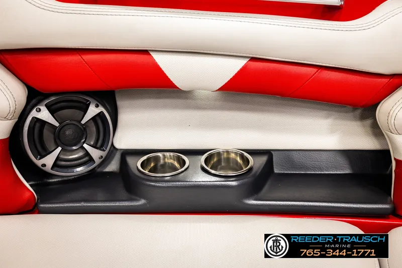 Slide: The Image of Red and white interior of 2017 Malibu Wakesetter 25 LSV with speaker and cup holders. - 44