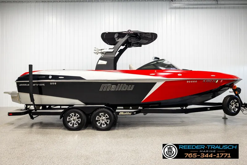 Slide: The Image of 2017 Malibu Wakesetter 25 LSV boat on trailer in showroom. - 5