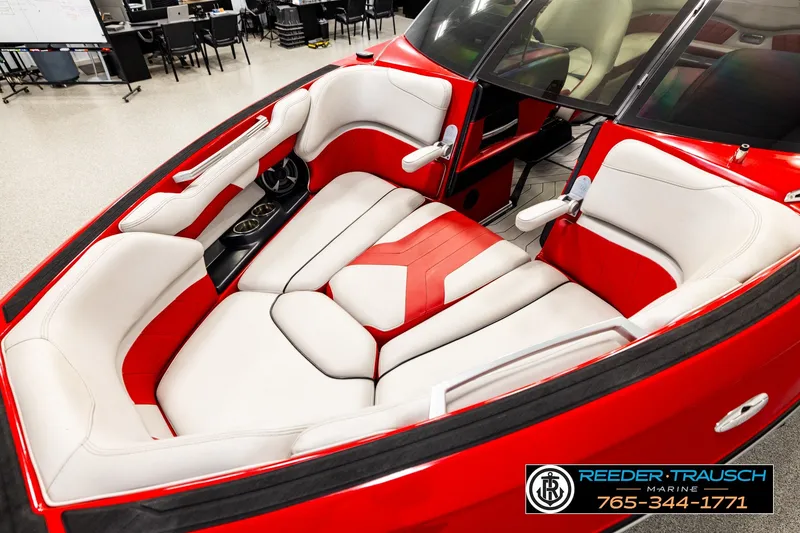 Slide: The Image of 2017 Malibu Wakesetter 25 LSV boat interior with red and white seating. - 10
