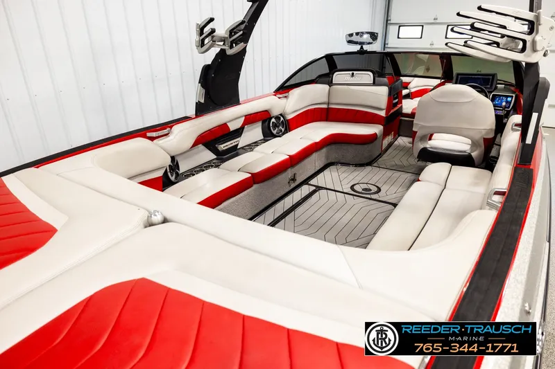 Slide: The Image of 2017 Malibu Wakesetter 25 LSV interior with red and white seating, sleek design. - 12