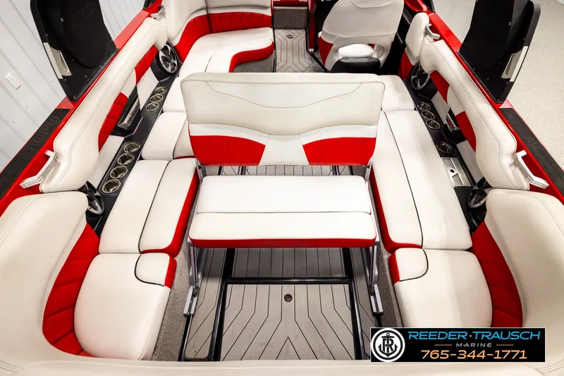 Slide: The Image of 2017 Malibu Wakesetter 25 LSV interior with red and white seating, cup holders, and sleek design. - 27
