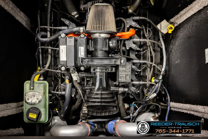 Slide: The Image of Engine of a 2017 Malibu Wakesetter 25 LSV boat, showcasing intricate components and wiring. - 25