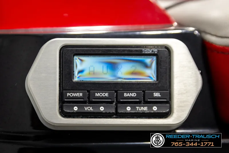 Slide: The Image of Close-up of a 2017 Malibu Wakesetter 25 LSV audio control panel. - 53