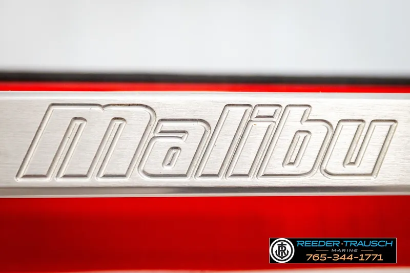 Slide: The Image of Malibu Wakesetter 25 LSV 2017 logo on metallic surface, Reeder-Trausch Marine contact info. - 45