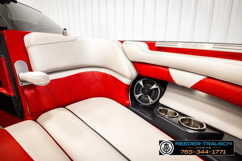 Slide: The Image of 2017 Malibu Wakesetter 25 LSV interior with red and white seating, speaker, and cup holders. - 43