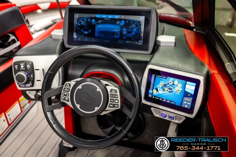 Slide: The Image of 2017 Malibu Wakesetter 25 LSV dashboard with advanced touchscreen controls and steering wheel. - 33