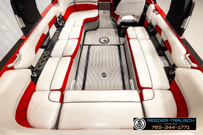 Slide: The Image of 2017 Malibu Wakesetter 25 LSV interior with red and white seating, cup holders, and sleek design. - 26