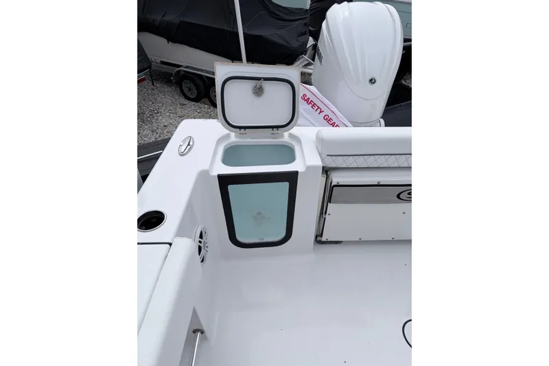 Slide: The Image of 2024 Sportsman Open 232 Center Console boat with open storage compartment. - 7