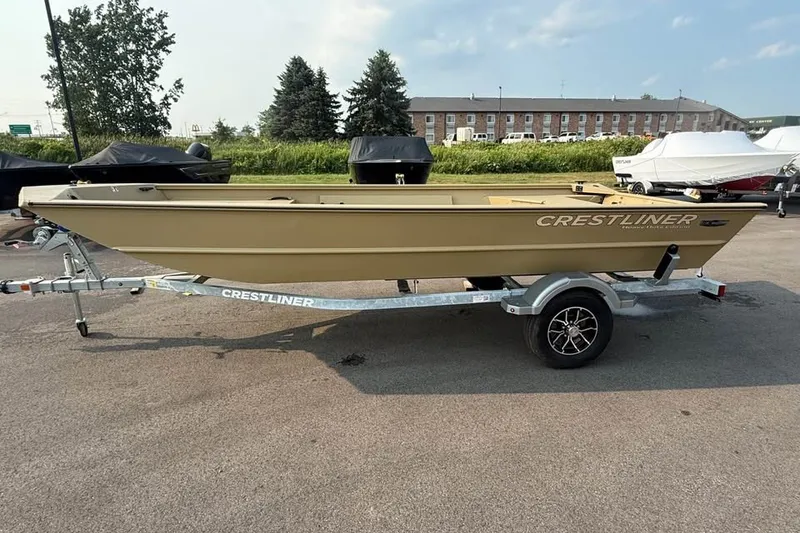 Slide: The Image of 2026 Crestliner 1860 Retriever Deluxe boat on trailer, parked outdoors. - 2