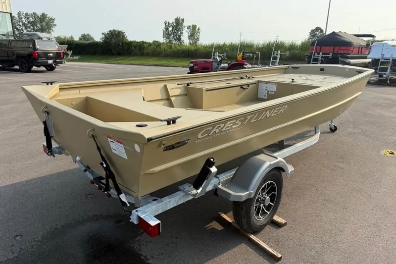 Slide: The Image of 2026 Crestliner 1860 Retriever Deluxe boat on trailer in outdoor setting. - 4