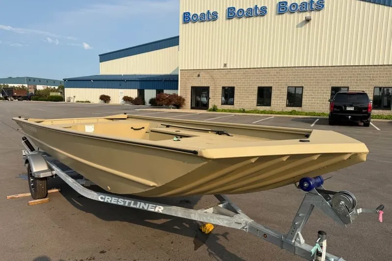 The Image of 2026 Crestliner 1860 Retriever Deluxe boat on trailer outside dealership. - 0