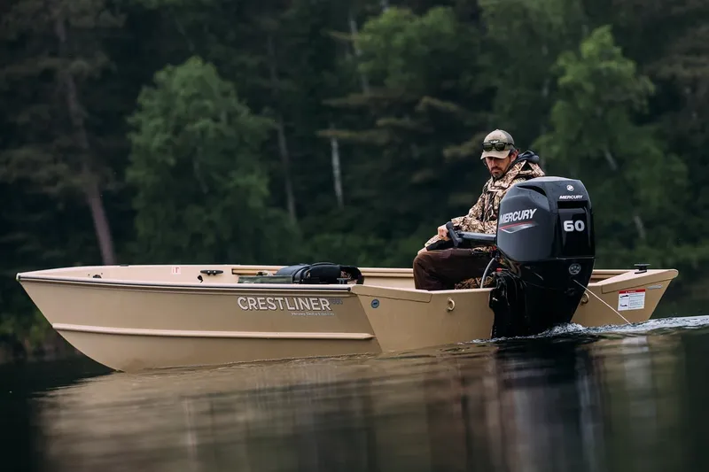 Slide: The Image of Manufacturer Provided Image: 2026 Crestliner 1860 Retriever Deluxe boat on calm water, with Mercury 60 engine. - 15