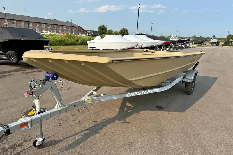 Slide: The Image of 2026 Crestliner 1860 Retriever Deluxe boat on trailer in outdoor setting. - 1
