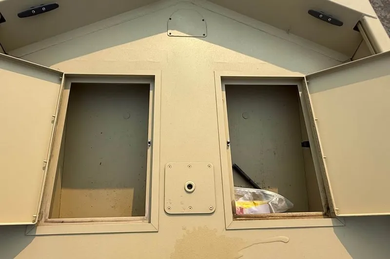 Slide: The Image of Open storage compartments on a 2026 Crestliner 1860 Retriever Deluxe boat. - 9