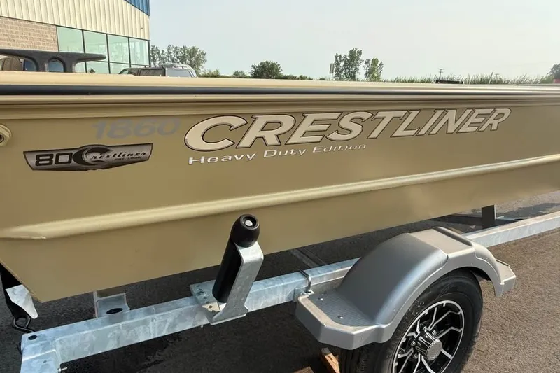 Slide: The Image of 2026 Crestliner 1860 Retriever Deluxe boat on trailer, heavy-duty edition. - 12