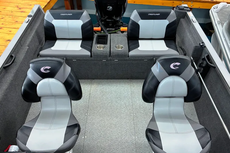 Slide: The Image of 2023 Crestliner 1650 Fish Hawk interior with four cushioned seats and cup holders. - 3