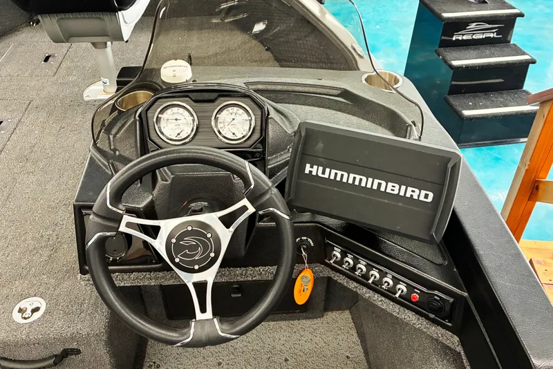 Slide: The Image of 2023 Crestliner 1650 Fish Hawk dashboard with steering wheel and Humminbird fish finder. - 5