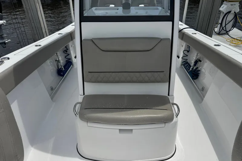 Slide: The Image of 2024 Sportsman Heritage 261 Center Console boat interior with cushioned seating. - 19