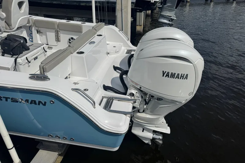 Slide: The Image of 2024 Sportsman Heritage 261 Center Console with twin Yamaha outboard engines. - 22