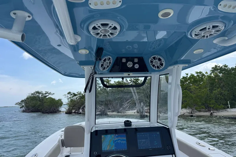 Slide: The Image of 2024 Sportsman Heritage 261 Center Console boat interior with advanced navigation system. - 7