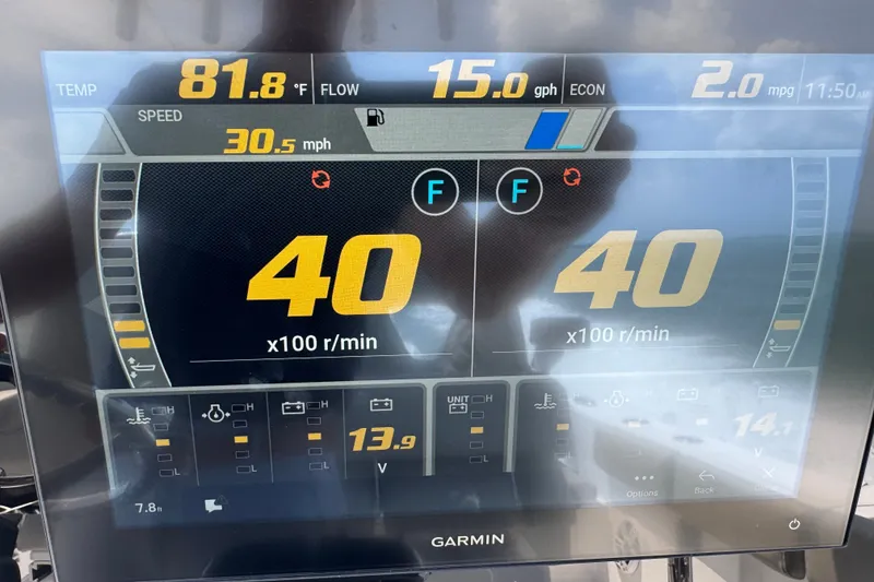 Slide: The Image of 2024 Sportsman Heritage 261 Center Console dashboard displaying speed, temperature, and engine RPM. - 14