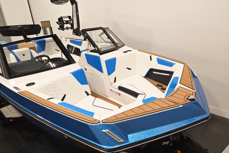 Slide: The Image of 2027 Nautique Super Air Nautique GS20 boat with blue and white interior, sleek design. - 3