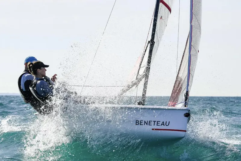 Slide: The Image of Manufacturer Provided Image: Sailors navigating Beneteau First 14 SE, 2026 model, through ocean waves. - 1