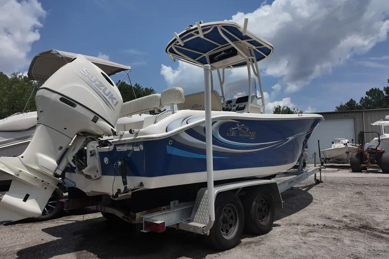 Slide: The Image of 2018 Sea Chaser 22 HFC boat with Suzuki outboard motor on trailer. - 2