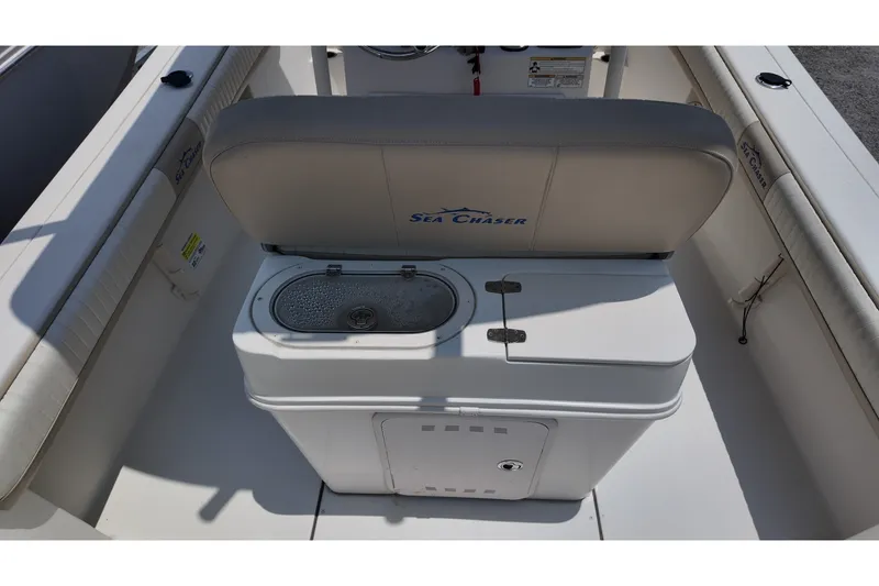 Slide: The Image of 2018 Sea Chaser 22 HFC boat interior with seating and storage compartment. - 13