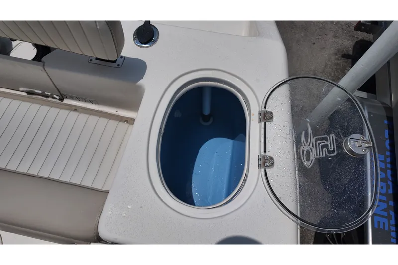 Slide: The Image of 2018 Sea Chaser 22 HFC boat with open livewell and seating area. - 12