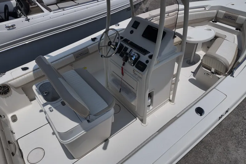 Slide: The Image of 2018 Sea Chaser 22 HFC boat interior with helm, seating, and console. - 5