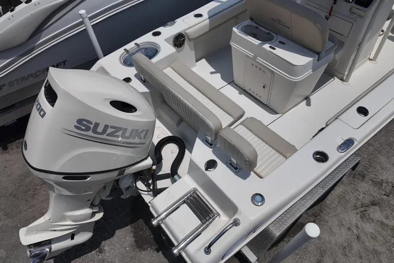 Slide: The Image of 2018 Sea Chaser 22 HFC boat with Suzuki engine, featuring spacious seating and modern amenities. - 4