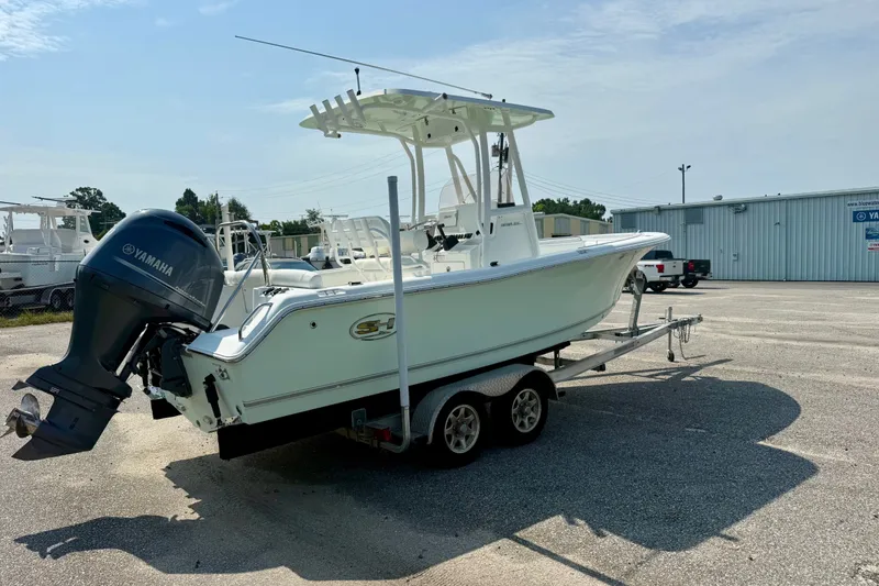 Slide: The Image of 2016 Sea Hunt Ultra 211 boat on trailer with Yamaha outboard motor. - 4
