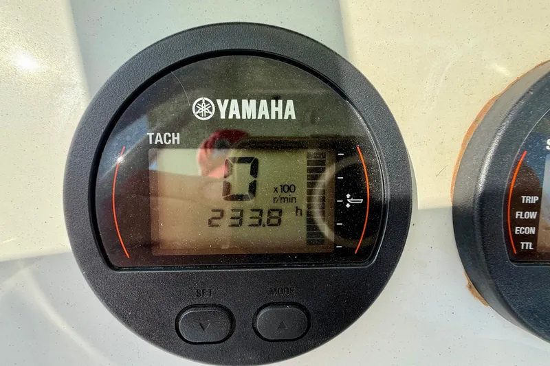 Slide: The Image of Yamaha tachometer displaying 233.8 hours on a 2016 Sea Hunt Ultra 211 boat. - 13