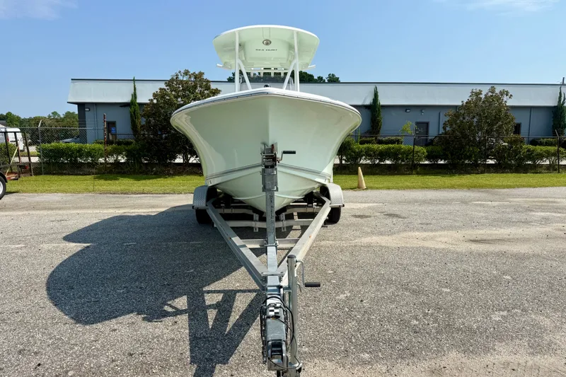 Slide: The Image of 2016 Sea Hunt Ultra 211 boat on trailer, parked outdoors. - 6
