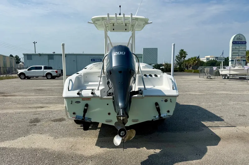 Slide: The Image of 2016 Sea Hunt Ultra 211 boat with 200 HP engine, parked outdoors. - 3