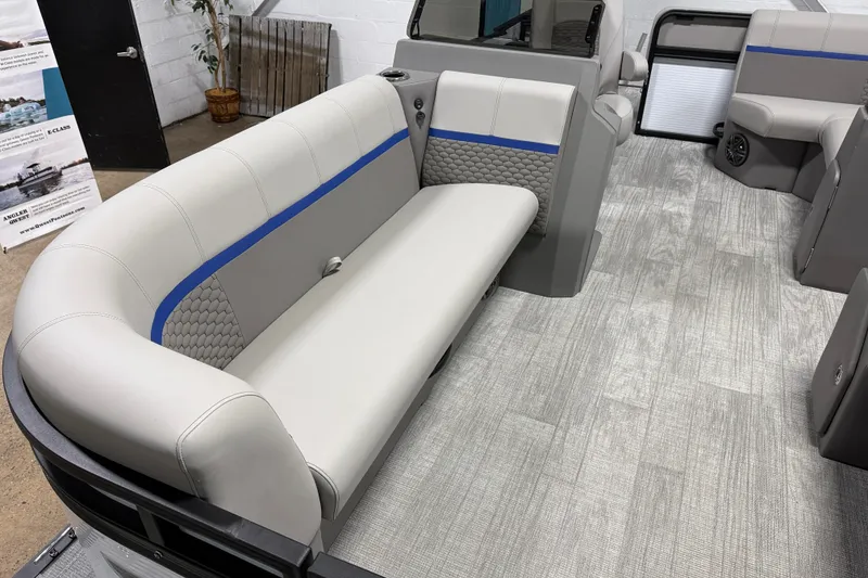 Slide: The Image of Luxurious interior of 2025 Qwest 8518 LANAI LT pontoon boat with stylish seating. - 8