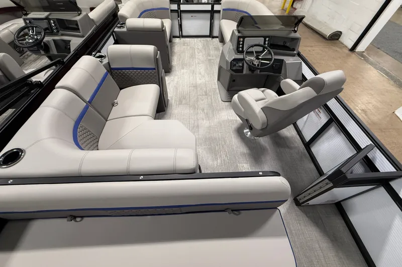 Slide: The Image of Interior of 2025 Qwest 8518 LANAI LT pontoon boat with modern seating and helm. - 6