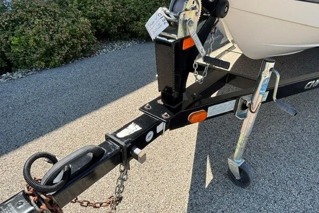 Slide: The Image of Trailer hitch of a 2012 Chaparral 19 H2O Ski & Fish boat on pavement. - 24