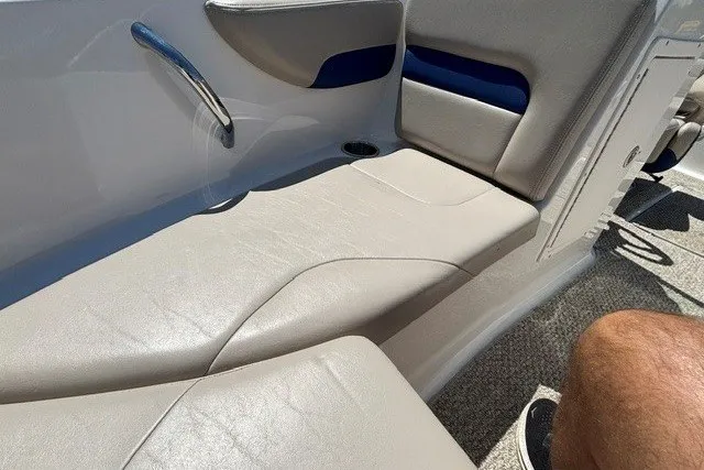 Slide: The Image of 2012 Chaparral 19 H2O Ski & Fish boat interior seating with beige upholstery. - 14