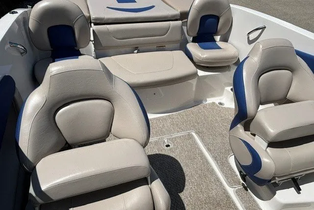 Slide: The Image of 2012 Chaparral 19 H2O Ski & Fish boat interior with beige and blue seating. - 8