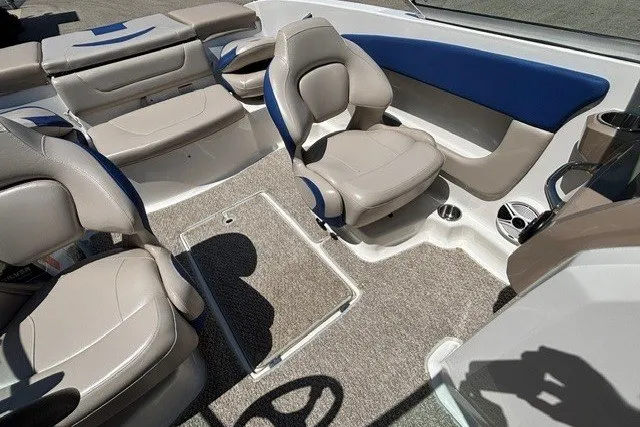 Slide: The Image of Interior of 2012 Chaparral 19 H2O Ski & Fish boat with beige seating and blue accents. - 17