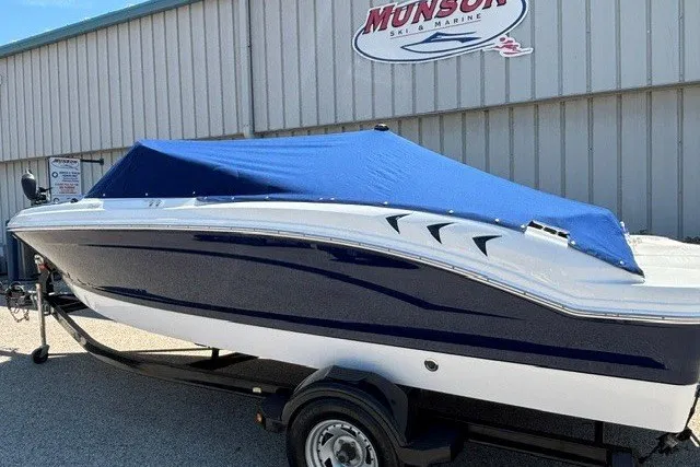 Slide: The Image of 2012 Chaparral 19 H2O Ski & Fish boat with blue cover on trailer. - 23
