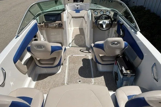Slide: The Image of 2012 Chaparral 19 H2O Ski & Fish boat interior with beige and blue seating. - 7