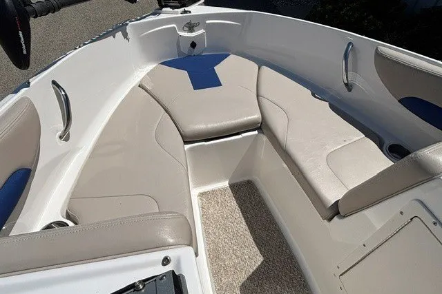 Slide: The Image of 2012 Chaparral 19 H2O Ski & Fish boat interior with beige seating and carpeted floor. - 6