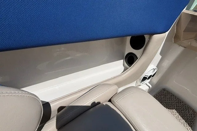 Slide: The Image of Interior view of 2012 Chaparral 19 H2O Ski & Fish boat with blue and beige seating. - 19