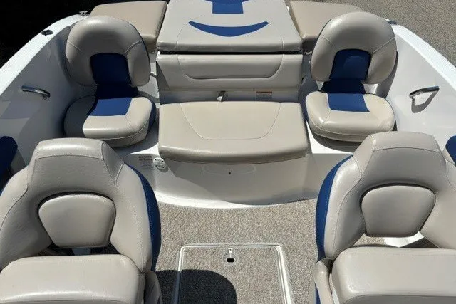 Slide: The Image of 2012 Chaparral 19 H2O Ski & Fish boat interior with cushioned seating. - 13